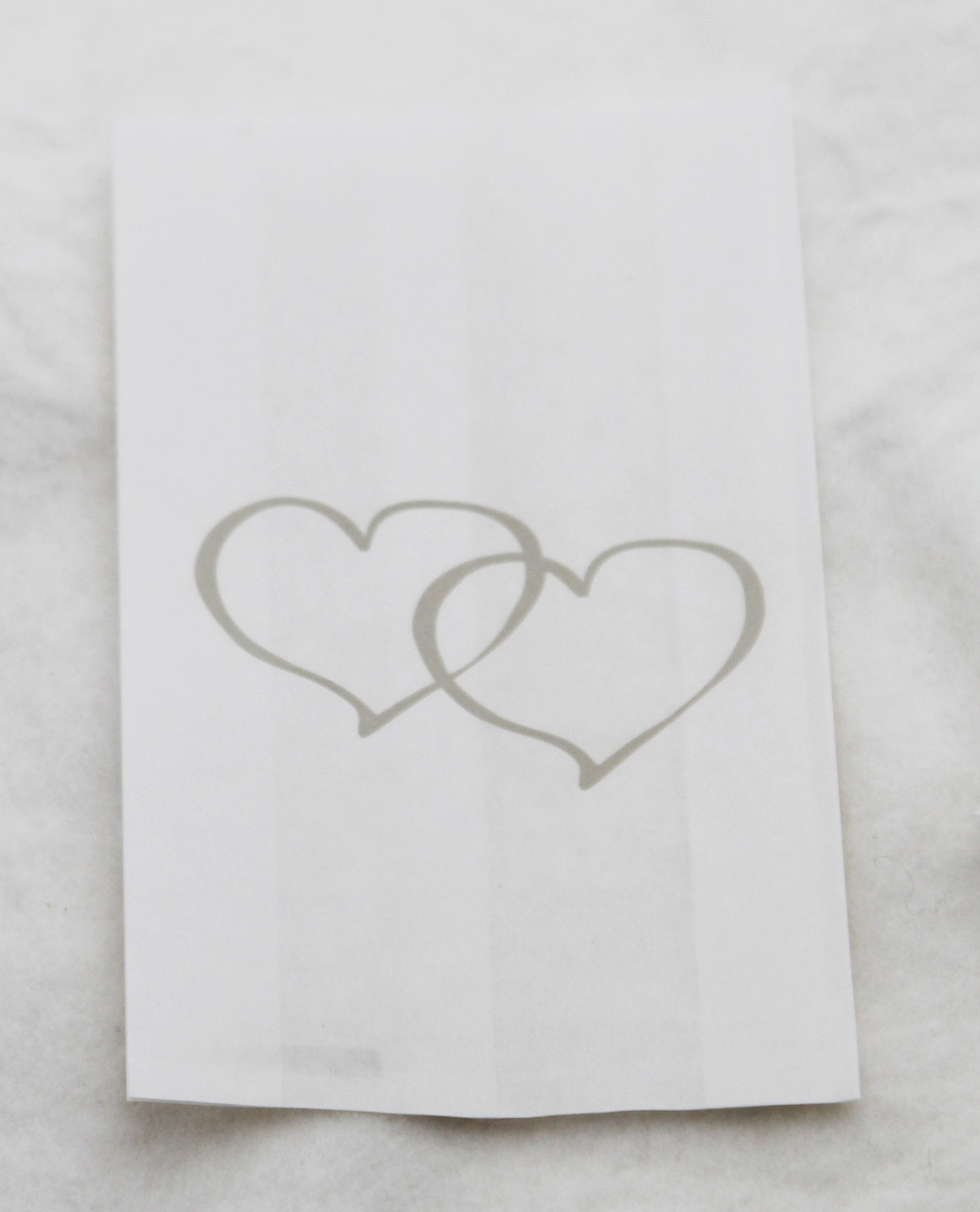 V382-CAKEBAG100SILHRT-202503040841-00 100 Pack Wedding Cake Bags Greaseproof Wax Paper Slice Take Home Favour Large Silver Heart - Image 1