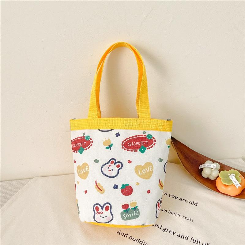 V562-5051124060DBT-202503041320-00 Cartoon Graffiti Bento Bag - Cute Canvas Handbag - Model 1 Yellow - Image 1