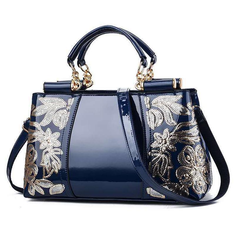V562-B1088132060DBT-202503041335-00 Shiny Leather Handbag with Single-sided Embroidery - Blue - Image 1