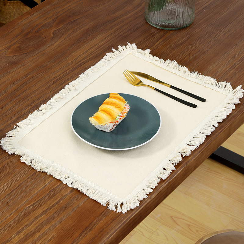 V888-ELOSUNG22390-202503261153-00 4 PCS Beige Cotton Linen Placemat with Fringe - Solid Color Table Mat for Dining (45X30CM) - Image 1