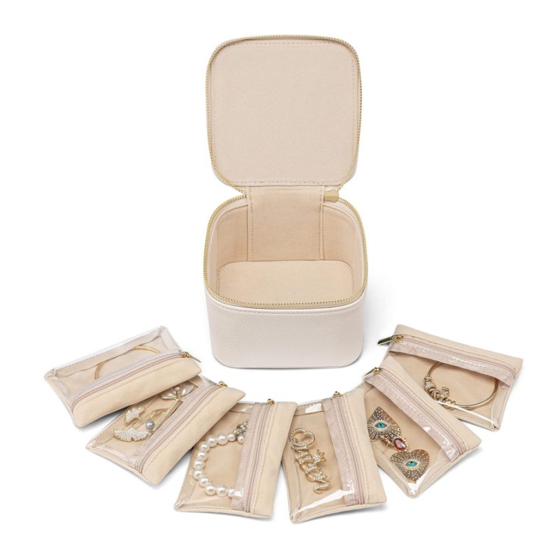 V888-ELOSUNG26472-202504281531-00 White Compact Travel Jewelry Box with 6 Individual Velvet Zipper Pouches - Image 1