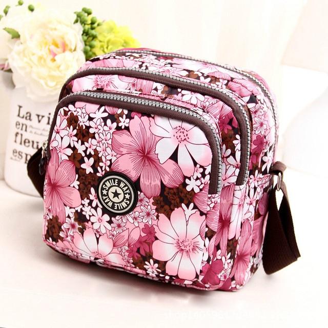 V562-L1039221110DBT-202508291131-00 Waterproof Nylon Multilayer Crossbody Bag For Women - Pink Flower - Image 1